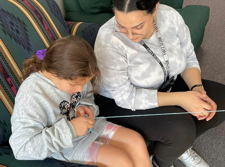 Club staff member and child
