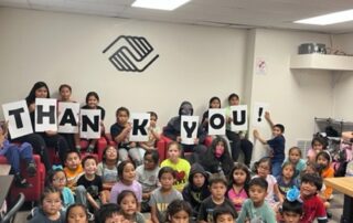 Warm Springs kids holding thank you signs
