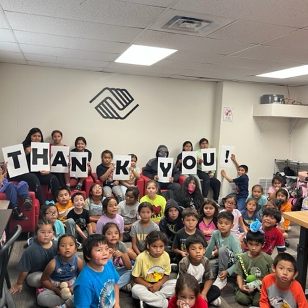 Warm Springs kids holding thank you signs