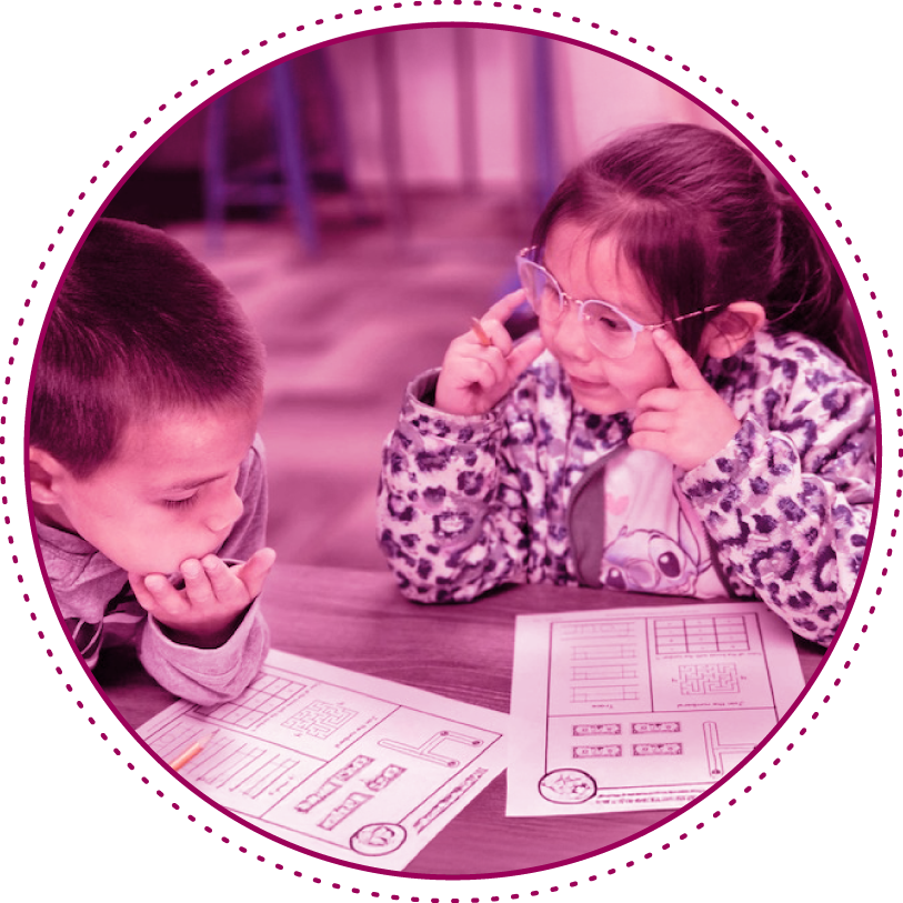 academic_success girl and boy doing homework at a table