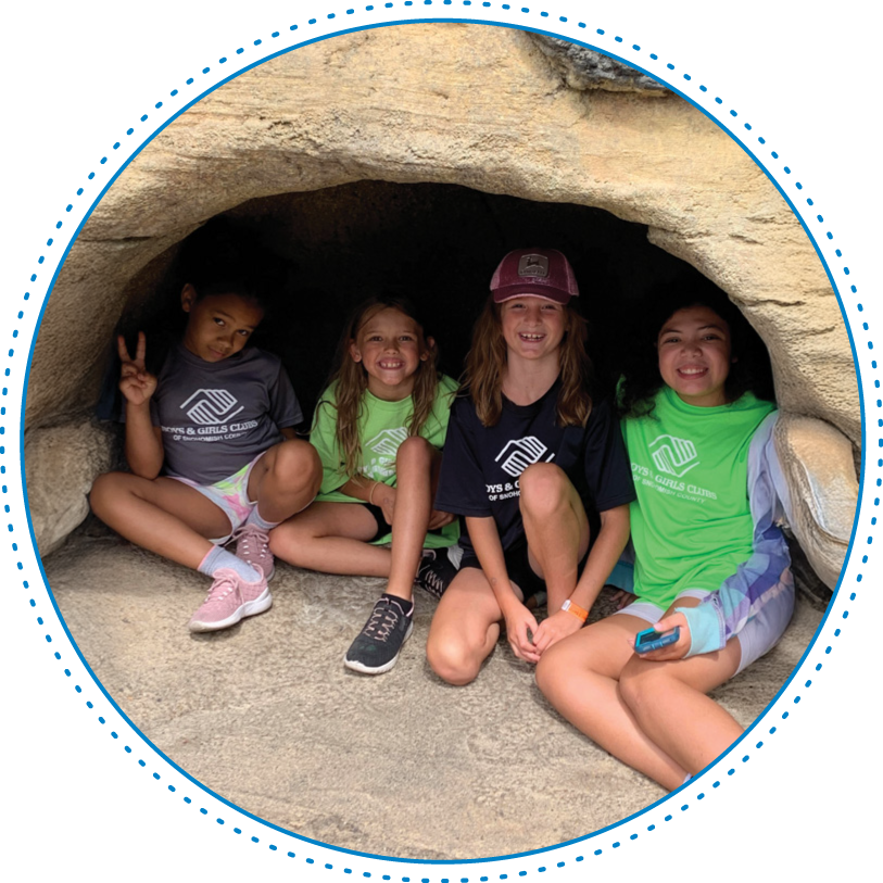 camp_hero 4 girls sitting in the mouth of. a cave