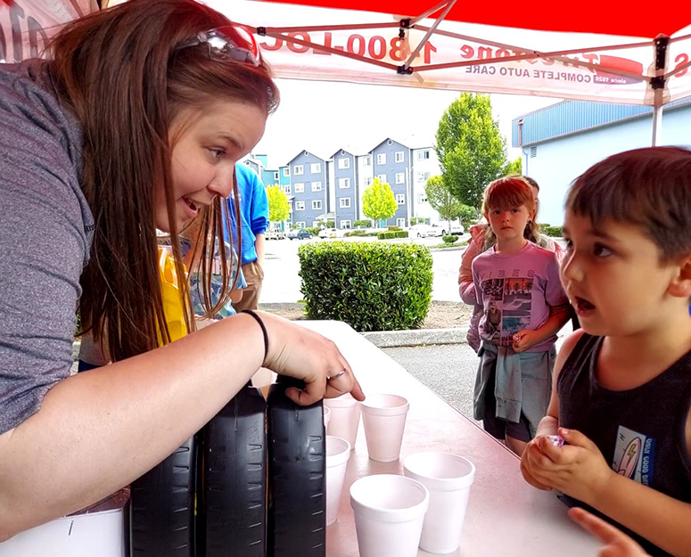 everett_camp Everett boy talking to woman at booth