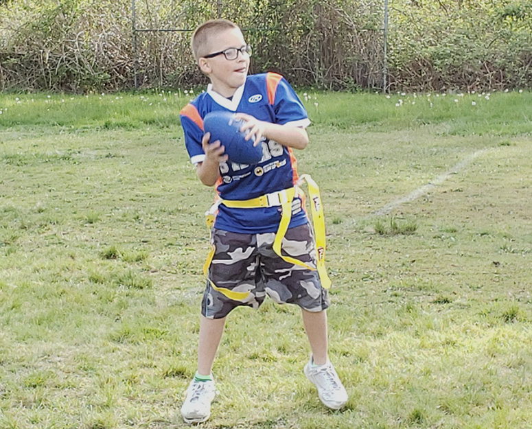 sultan_sports Sultan boy playing flag football about to throw a pass