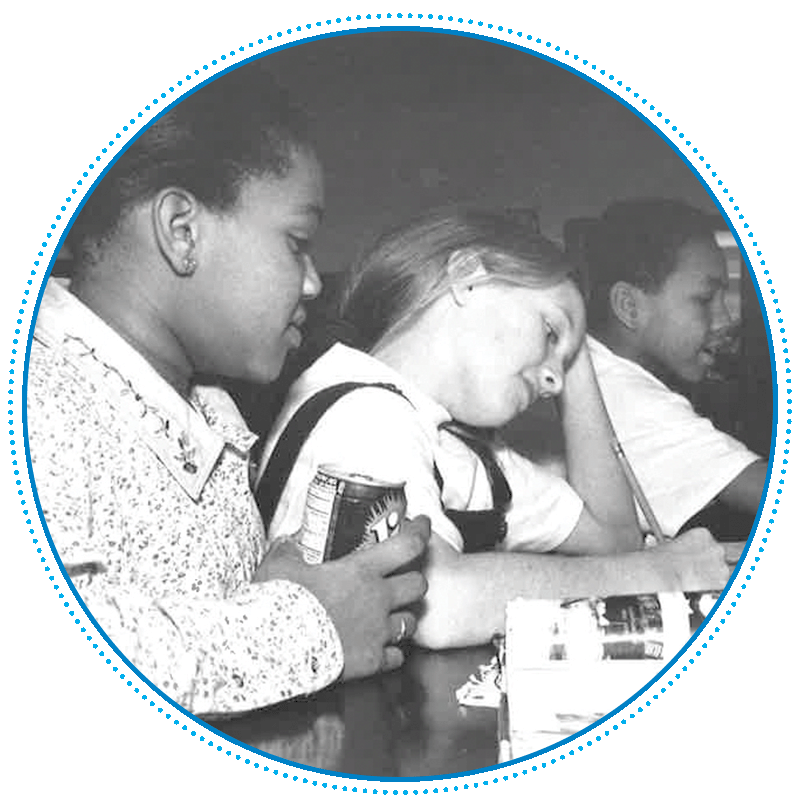 black & white picture of 3 girls doing homework