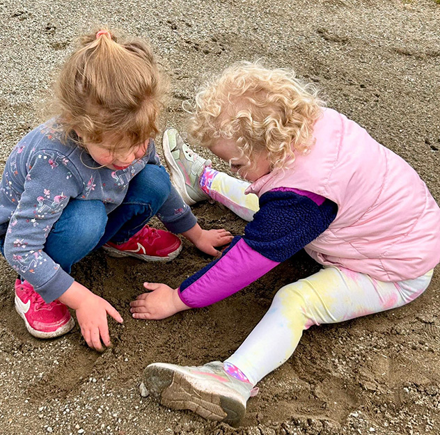 2 little girls playing in sand Lake Chelan