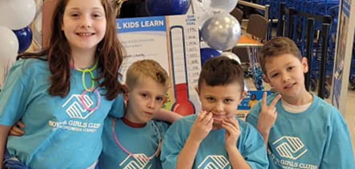 group of kids wearing boys & girls club t-shirts