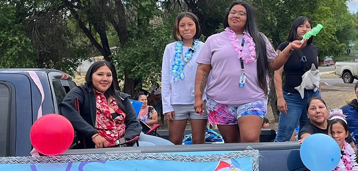 teenage girls in back of pickup truck