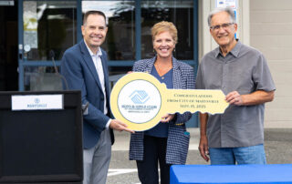 Bill Tsoukalas and Marci Volmer with ceremonial key