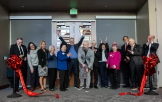 Volunteers of America Western Washington cut a ribbon outside new Boys & Girls Club